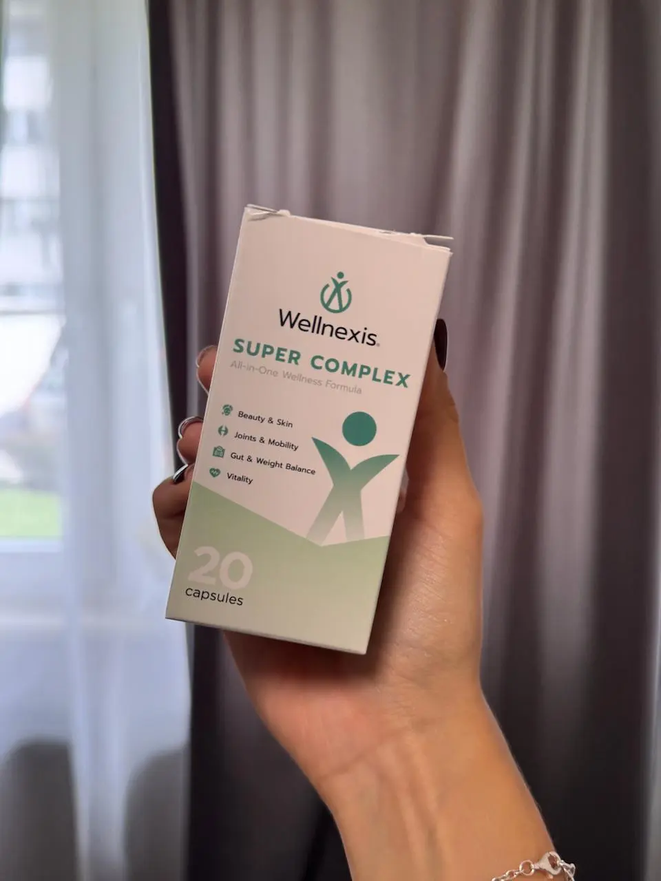 Klientka z produktem Wellnexis